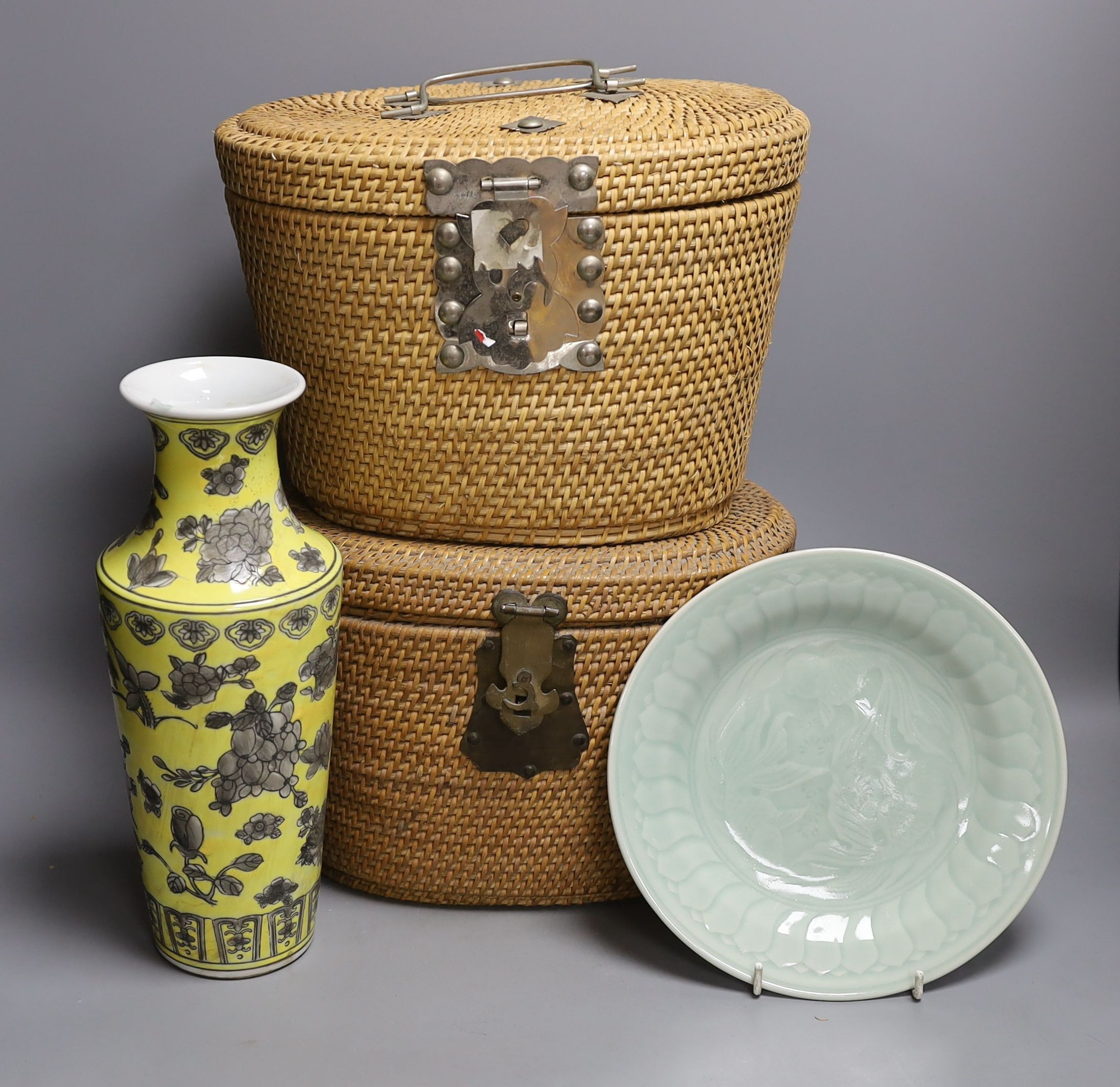 Two wicker-cased Chinese porcelain teapots together with a Chinese celadon dish and yellow vase, 28cm tall, (4)